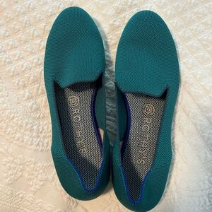 Green Rothy’s, size 7.5